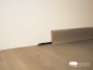 Preview: Massivholz Sockelleisten Eiche hell weiss matt lackiert